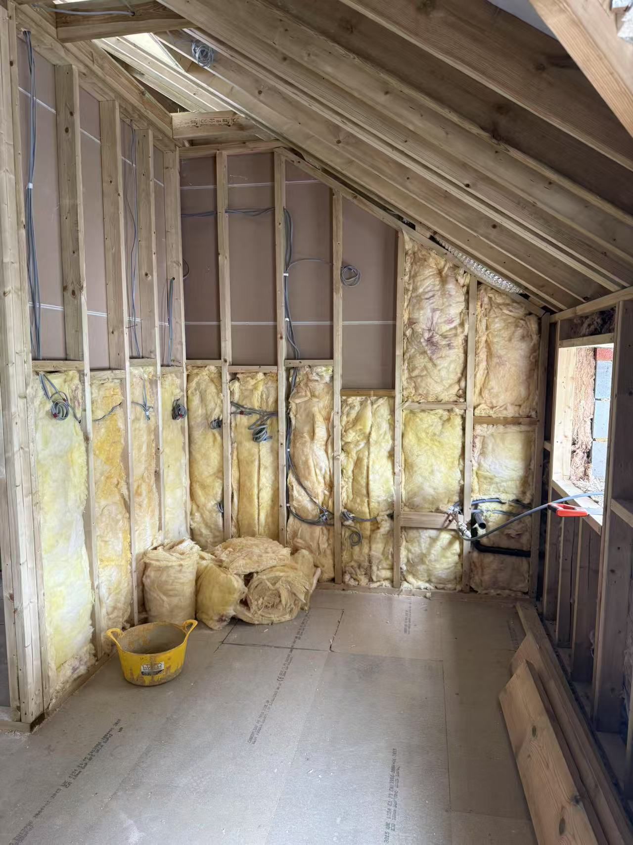 Raw timber frame structure — walls and wiring before plastering