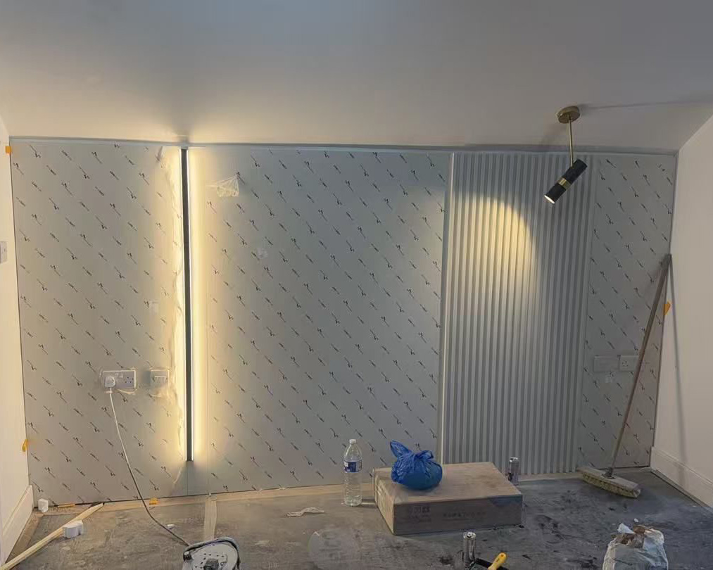 Feature wall panels being installed mid-build using VR as reference